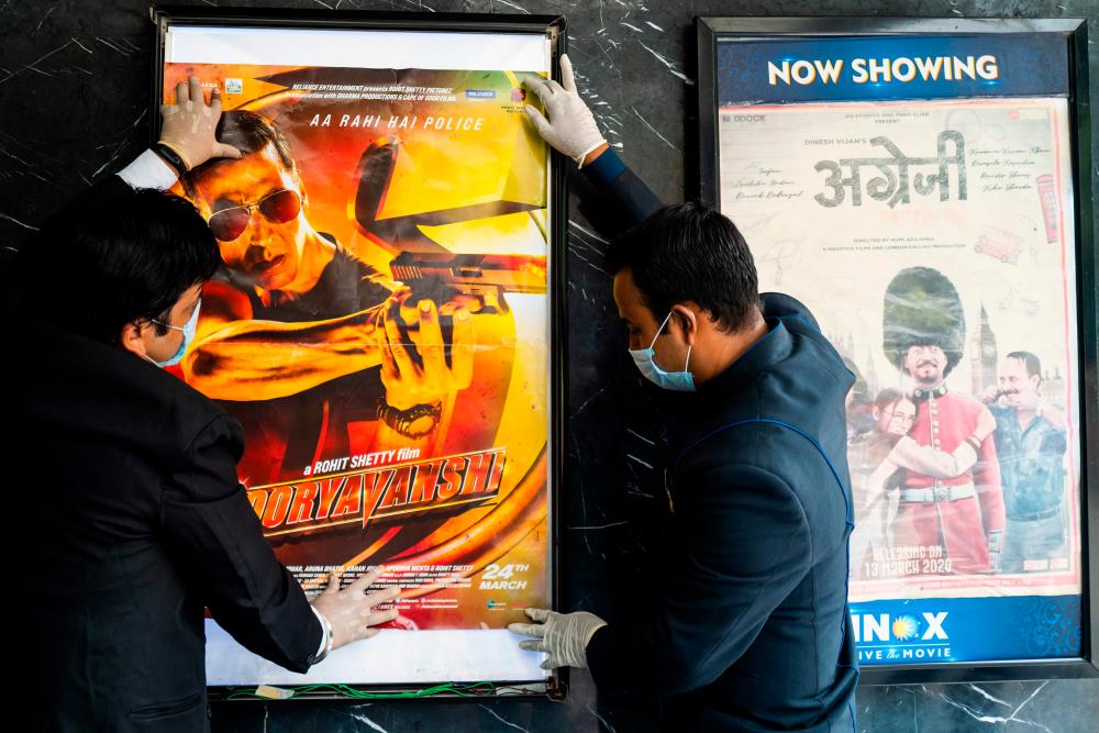 India cinemas reopen, hoping to lure back movie-mad fans
