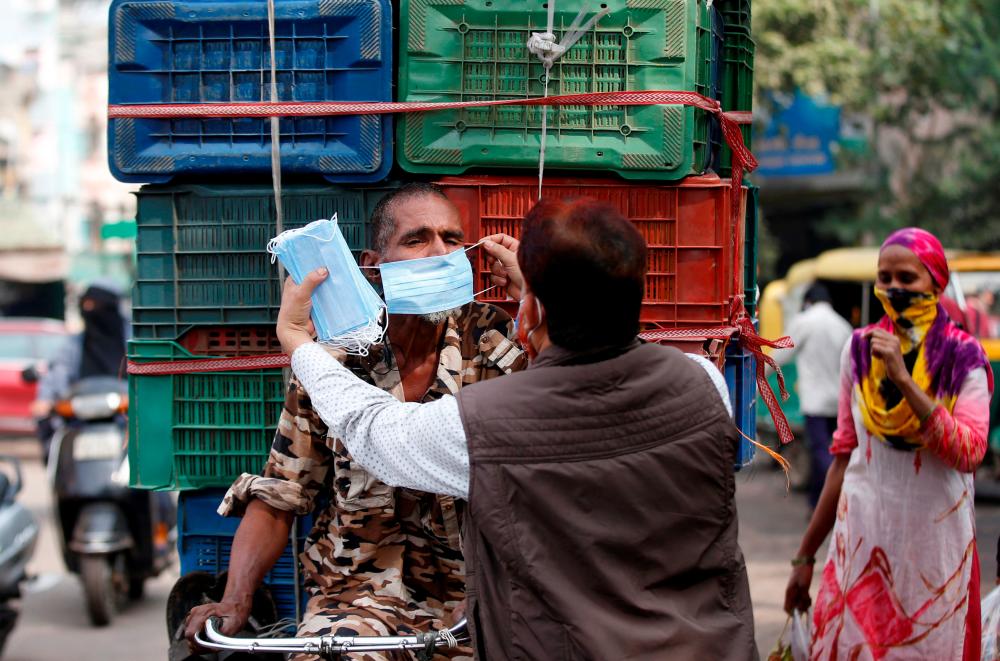India’s new Covid-19 cases hit seven-month high of 141,986