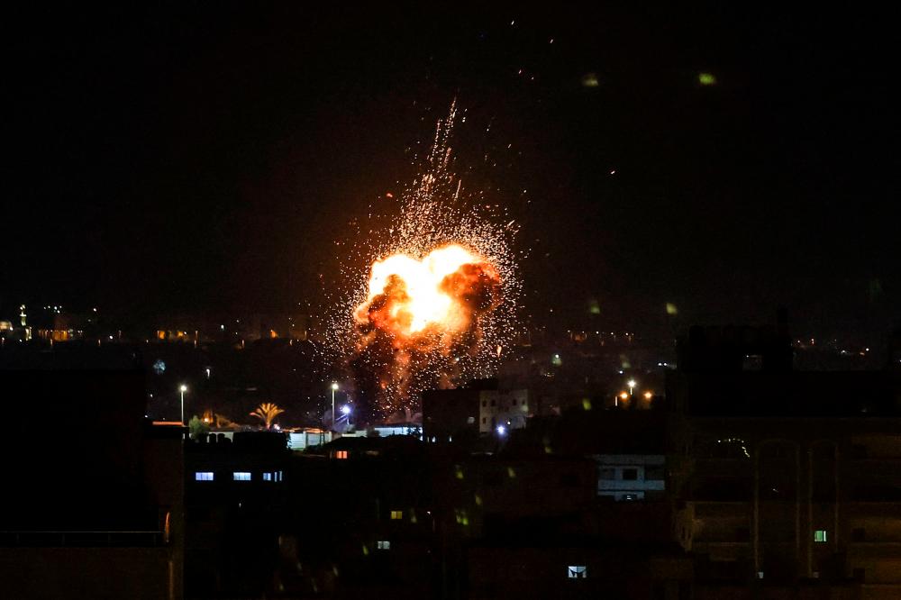 Israel, Gaza militants trade missiles after deadly West Bank raid