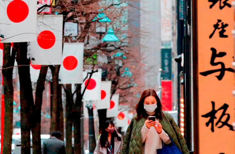 Japan PM pinning hopes on big-spending tourists to revive economy