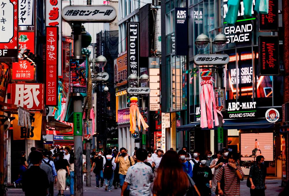 Japan’s daily Covid-19 cases top 230,000, record for 2nd straight day