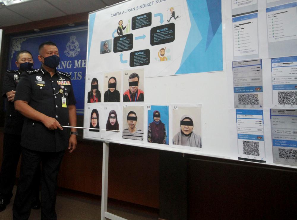 Johor police arrest 8, allegedly involved in fake vax certs sale