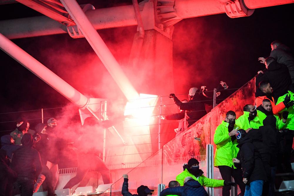 Paris FC and Lyon thrown out of French Cup for fan violence