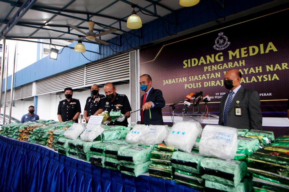 Police seize drugs worth over RM23 million, nab man, son