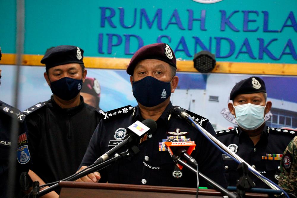 Police shoot two individuals, believed to be Abu Sayyaf group members, in Sandakan Police shoot two individuals, believed to be Abu Sayyaf group members, in Sandakan