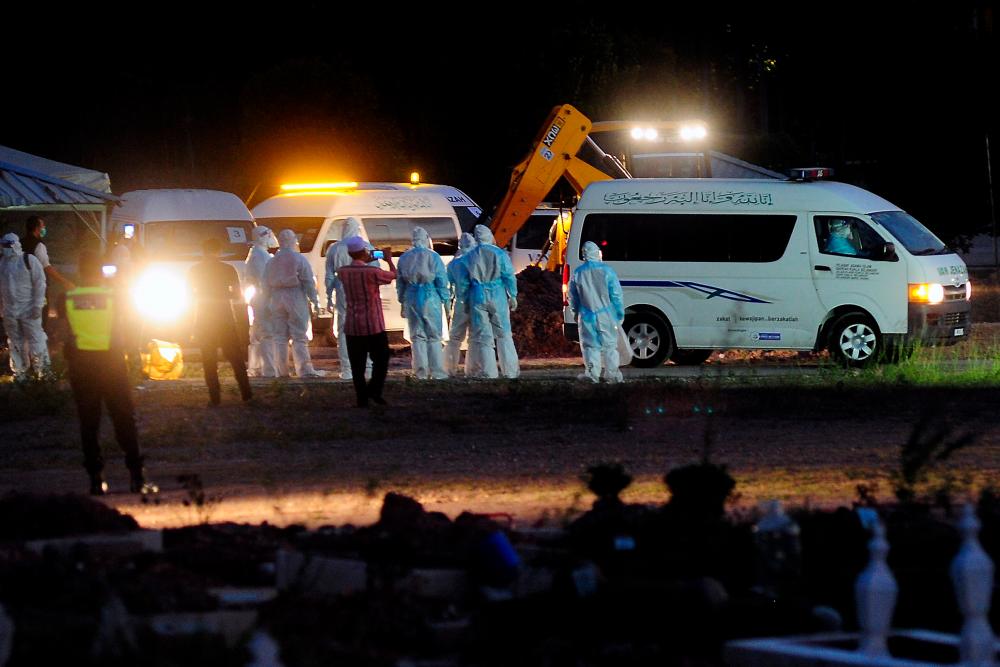 Sombre mood as remains of Covid-19 victims laid to rest