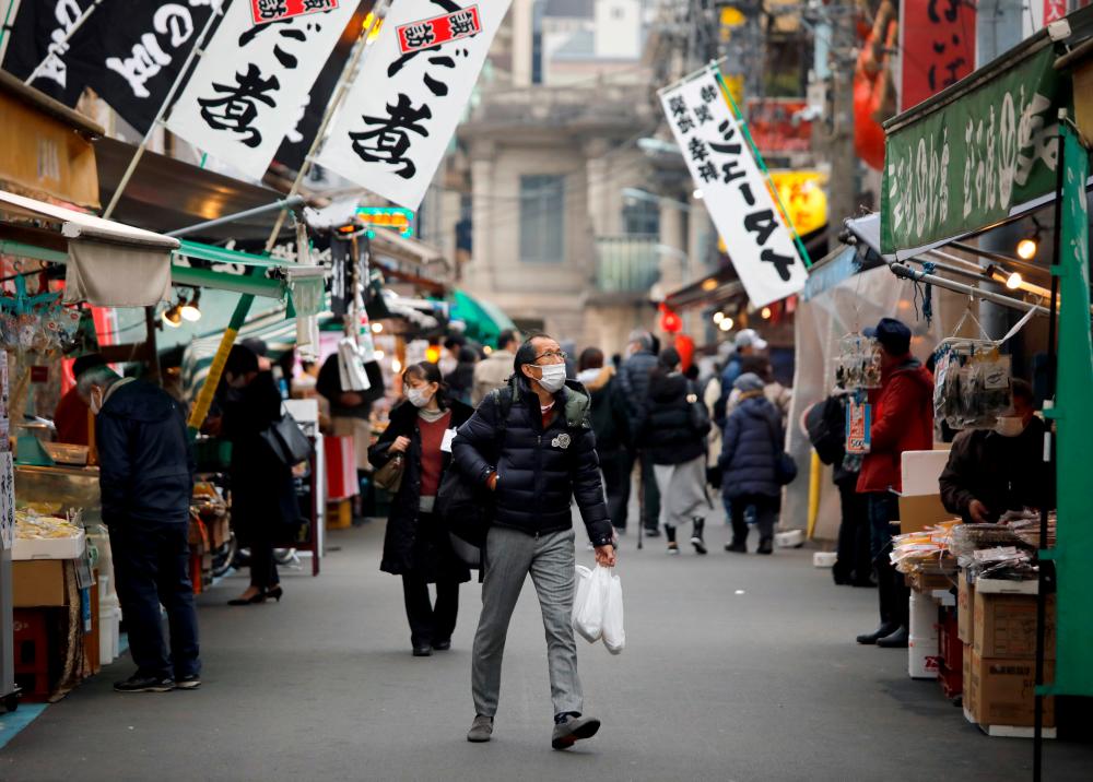 Tokyo virus cases hit record 949 ahead of New Year holiday