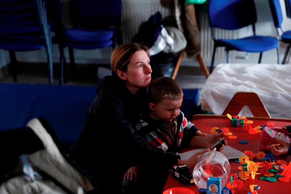 Two hopeful Ukranian women vow to stay put despite Russia’s bombardment