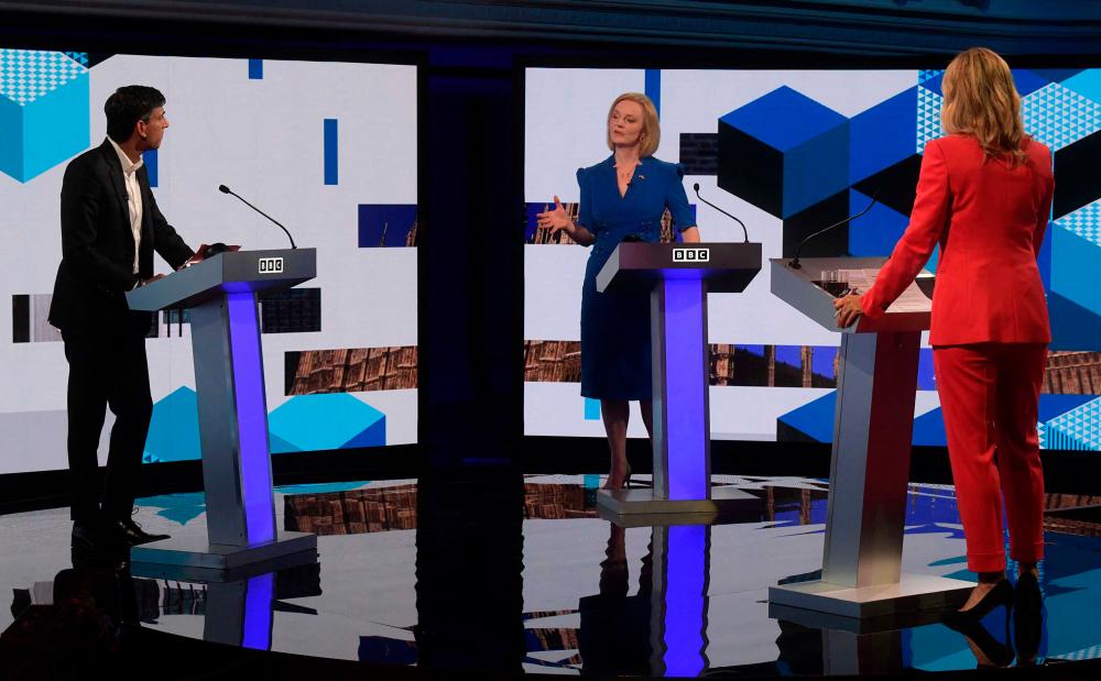 UK PM rivals spar over tax, China in first head-to-head TV debate UK PM rivals spar over tax, China in first head-to-head TV debate