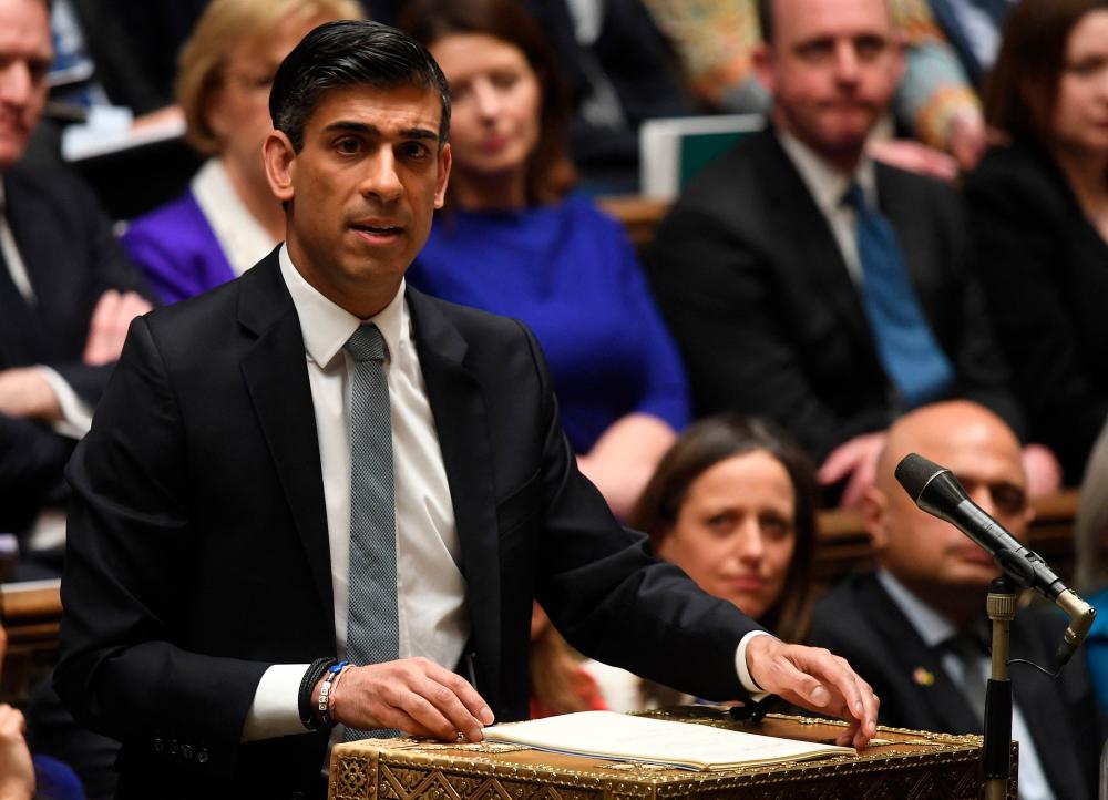 UK finance minister tries to ease cost-of-living hit with tax cuts UK finance minister tries to ease cost-of-living hit with tax cuts