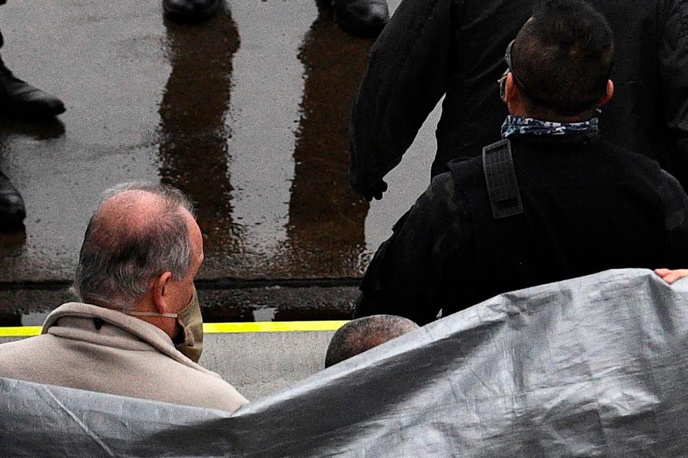 US father-son duo admit helping Ghosn flee Japan in Tokyo court