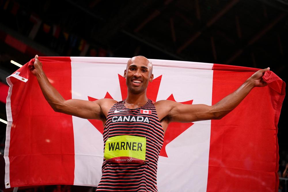 Warner breaks Olympic record to win Decathlon gold at Tokyo Olympics Warner breaks Olympic record to win Decathlon gold at Tokyo Olympics
