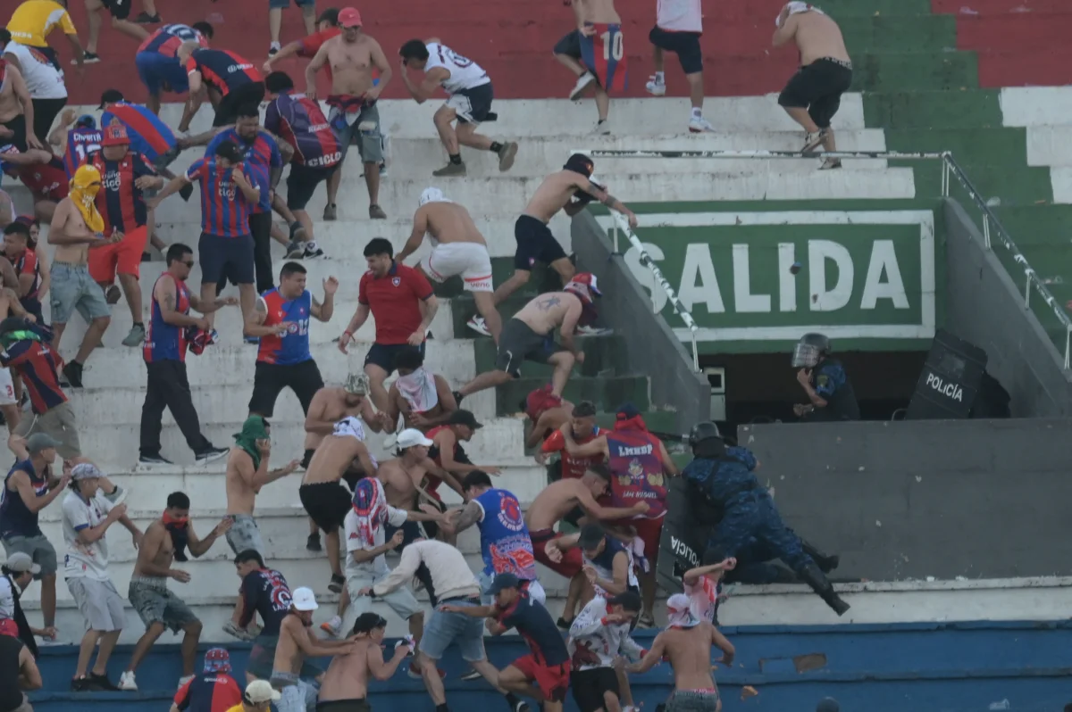 Paraguay football match suspended after violent fan clashes Paraguay football match suspended after violent fan clashes