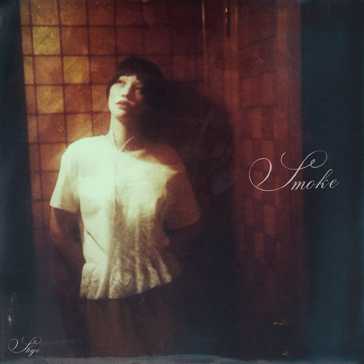 The song reflects a sense of disconnection, capturing moments where a person is physically present but internally detached from their surroundings.