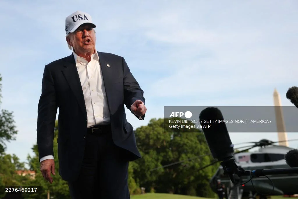 AFP_PresidentTrumpReturnsToWashingtonFromChina Trump says 'clock ticking' for Iran as peace negotiations stall