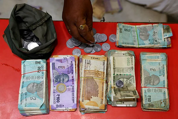 India scrambles to steady rupee as oil shock bites