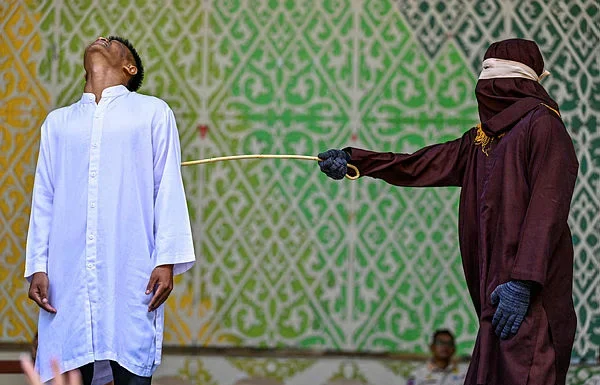 Four flogged in Aceh for sex outside marriage