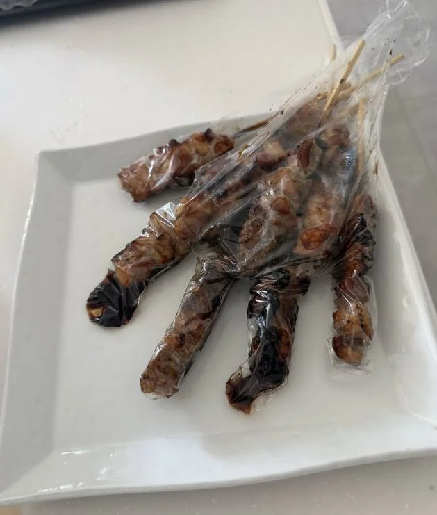 satay ‘Burnt fingers’ shock turns out to be satay packed in plastic glove
