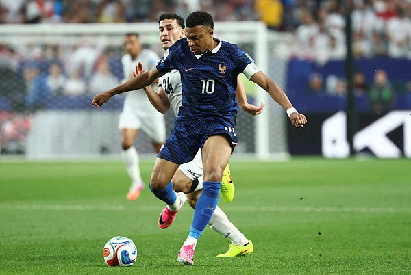 Mbappe scores twice as France beat Iraq at World Cup after two-hour storm delay Mbappe scores twice as France beat Iraq at World Cup after two-hour storm delay