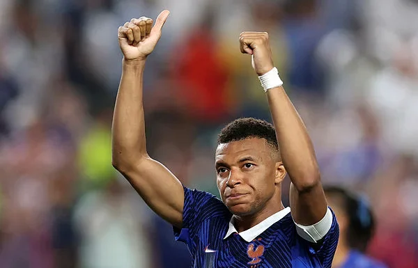 Mbappe scores twice as France beat Iraq at World Cup after two-hour storm delay