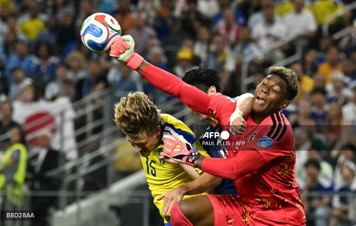Japan through to World Cup last 32 after 1-1 draw with Sweden