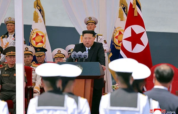 North Korea’s Kim unveils plans for 10,000-ton warships and nuclear navy