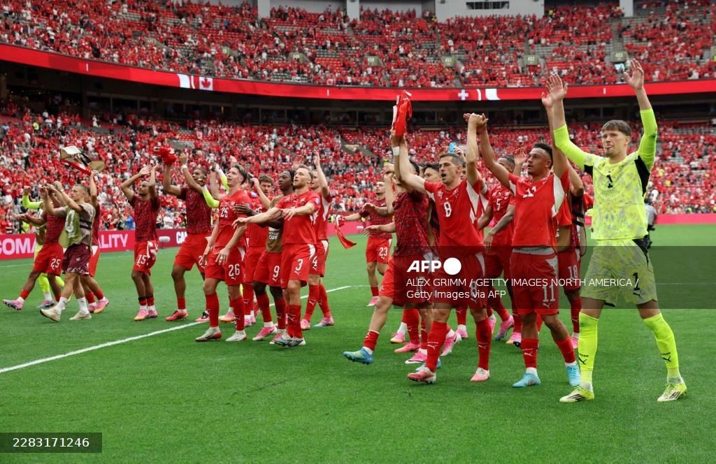 Switzerland down World Cup co-hosts Canada to top Group B, both progress
