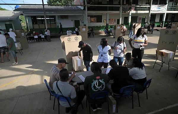 Colombia’s runoff election opens with stark choice for voters