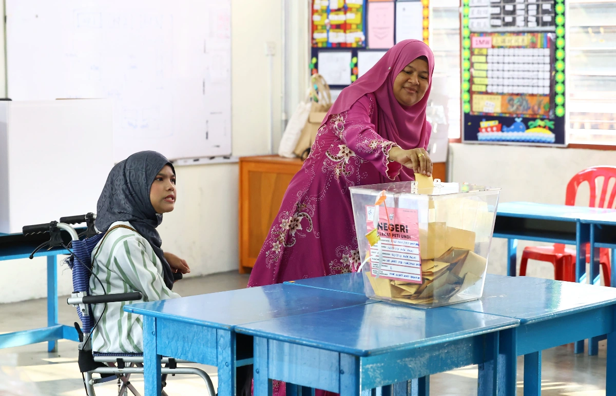 Disabled voters in Johor show determination at the polls