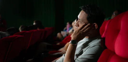 For many film lovers, the ritual of buying a ticket and entering the hall is still part of the appeal. – 123RFPIC